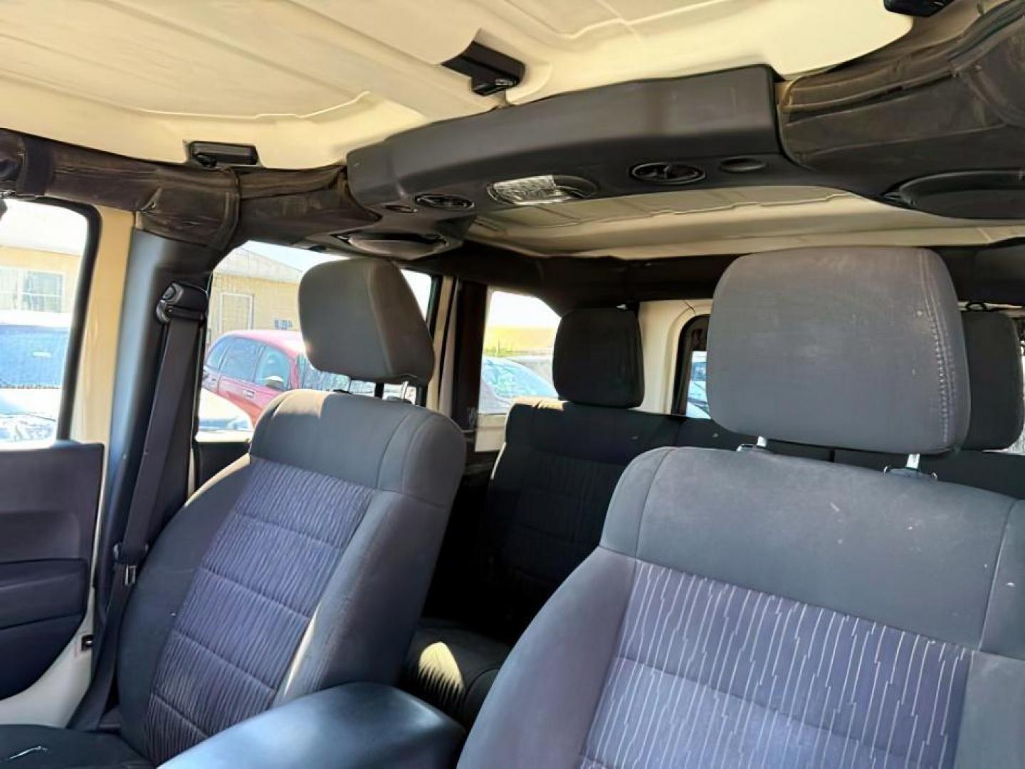 2012 TAN /CLOTH Jeep WRANGLER (1C4BJWEG2CL) with an 36 engine, Manual transmission, located at 1175 N Woodruff Ave, Idaho Falls, ID, 83401, 43.506901, -111.999657 - At Timberline Auto, finding a great deal on your next vehicle is always easy! Our experienced sales staff's goal is to help find you the right vehicle at the right price! Our knowledgeable finance department has options for almost any credit score. We offer extended service contract options to prote - Photo#15