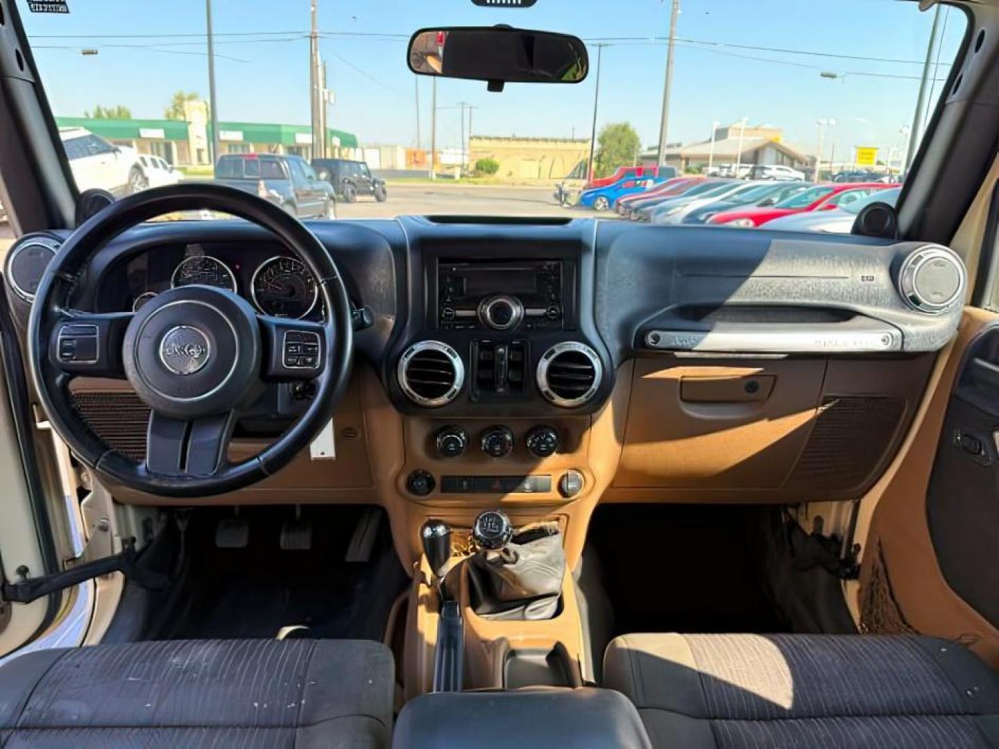 2012 TAN /CLOTH Jeep WRANGLER (1C4BJWEG2CL) with an 36 engine, Manual transmission, located at 1175 N Woodruff Ave, Idaho Falls, ID, 83401, 43.506901, -111.999657 - At Timberline Auto, finding a great deal on your next vehicle is always easy! Our experienced sales staff's goal is to help find you the right vehicle at the right price! Our knowledgeable finance department has options for almost any credit score. We offer extended service contract options to prote - Photo#17
