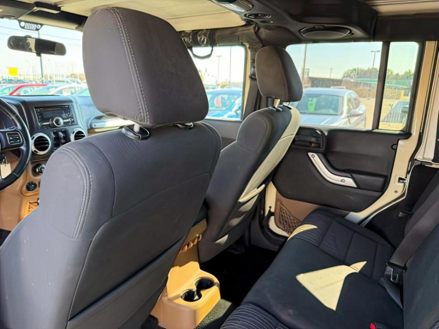 2012 TAN /CLOTH Jeep WRANGLER (1C4BJWEG2CL) with an 36 engine, Manual transmission, located at 1175 N Woodruff Ave, Idaho Falls, ID, 83401, 43.506901, -111.999657 - At Timberline Auto, finding a great deal on your next vehicle is always easy! Our experienced sales staff's goal is to help find you the right vehicle at the right price! Our knowledgeable finance department has options for almost any credit score. We offer extended service contract options to prote - Photo#18