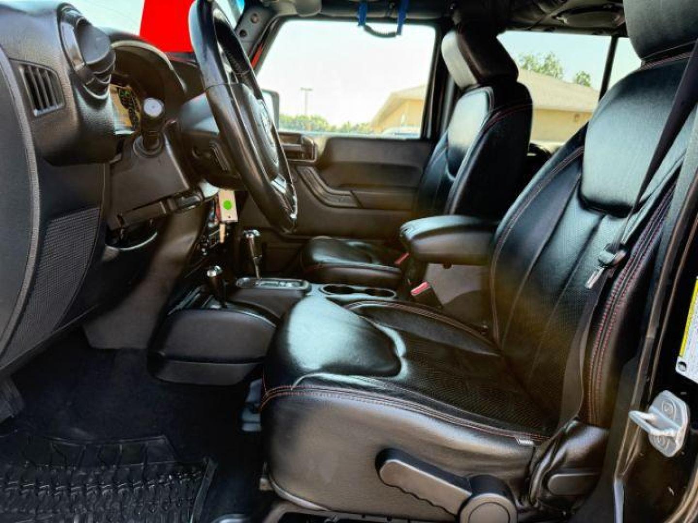 2013 BLACK /CLOTH Jeep Wrangler Unlimited (1C4HJWEG7DL) with an V6 engine, Automatic transmission, located at 1175 N Woodruff Ave, Idaho Falls, ID, 83401, 43.506901, -111.999657 - At Timberline Auto, finding a great deal on your next vehicle is always easy! Our experienced sales staff's goal is to help find you the right vehicle at the right price! Our knowledgeable finance department has options for almost any credit score. We offer extended service contract options to prote - Photo#34