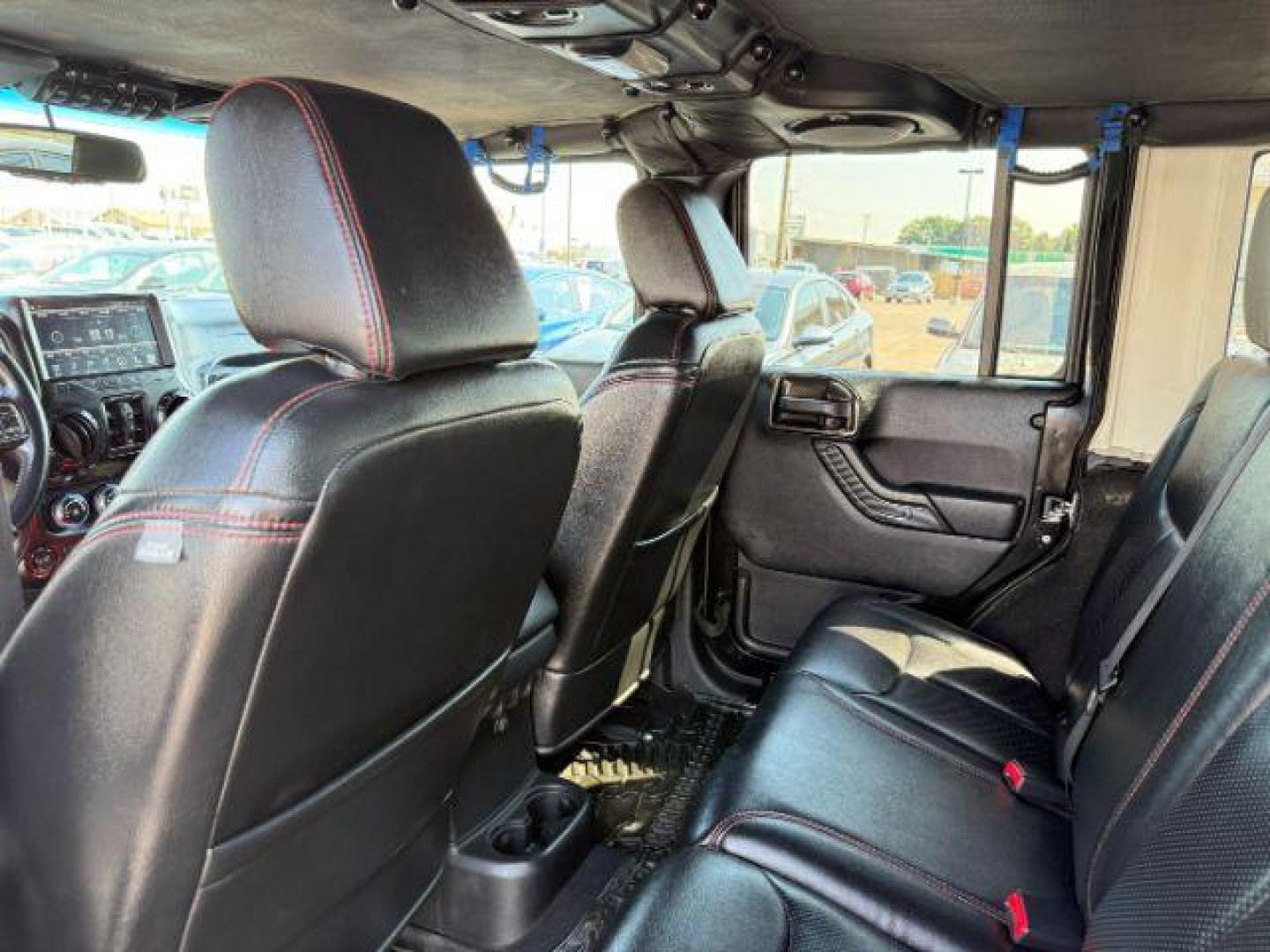 2013 BLACK /CLOTH Jeep Wrangler Unlimited (1C4HJWEG7DL) with an V6 engine, Automatic transmission, located at 1175 N Woodruff Ave, Idaho Falls, ID, 83401, 43.506901, -111.999657 - At Timberline Auto, finding a great deal on your next vehicle is always easy! Our experienced sales staff's goal is to help find you the right vehicle at the right price! Our knowledgeable finance department has options for almost any credit score. We offer extended service contract options to prote - Photo#42