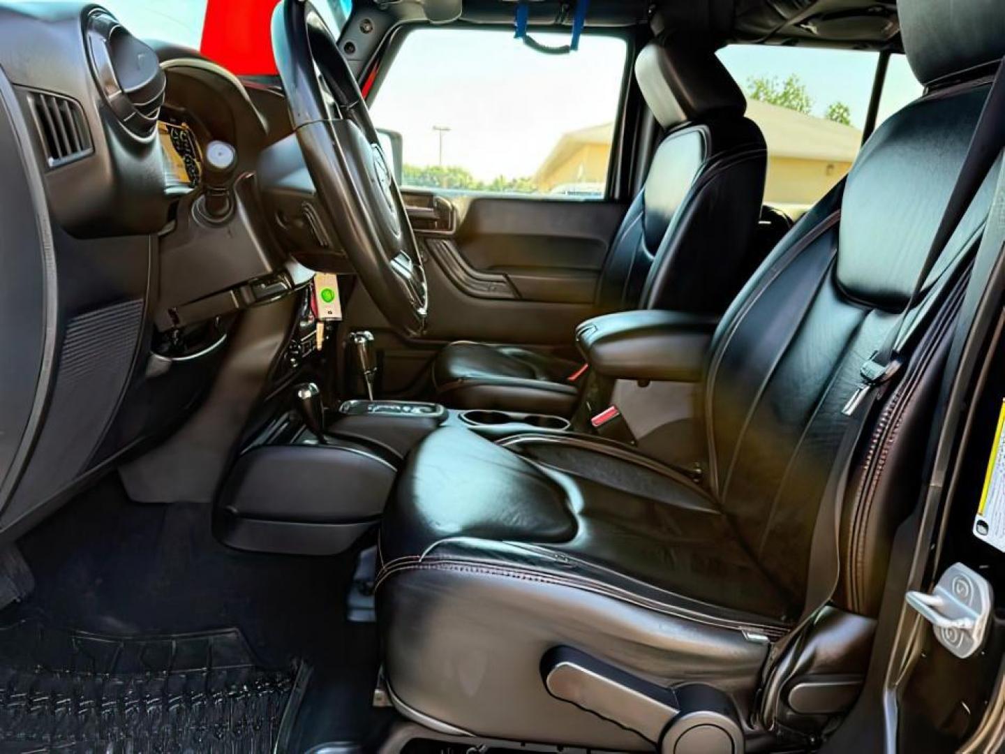 2013 BLACK /CLOTH Jeep Wrangler Unlimited (1C4HJWEG7DL) with an V6 engine, Automatic transmission, located at 1175 N Woodruff Ave, Idaho Falls, ID, 83401, 43.506901, -111.999657 - At Timberline Auto, finding a great deal on your next vehicle is always easy! Our experienced sales staff's goal is to help find you the right vehicle at the right price! Our knowledgeable finance department has options for almost any credit score. We offer extended service contract options to prote - Photo#12