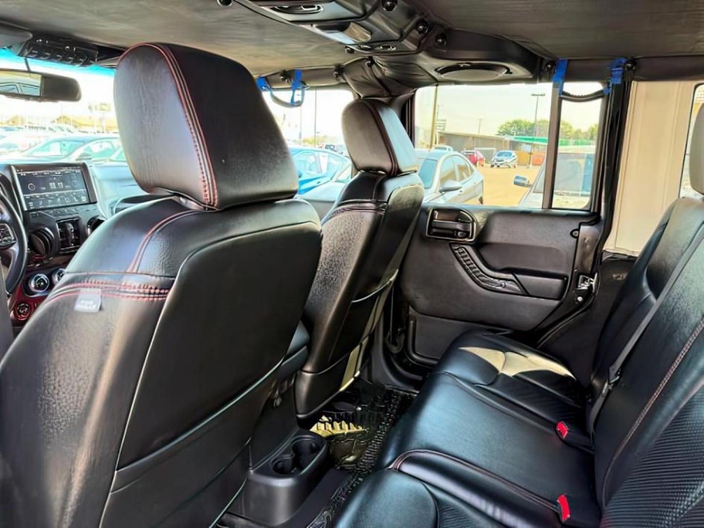 2013 BLACK /CLOTH Jeep Wrangler Unlimited (1C4HJWEG7DL) with an V6 engine, Automatic transmission, located at 1175 N Woodruff Ave, Idaho Falls, ID, 83401, 43.506901, -111.999657 - At Timberline Auto, finding a great deal on your next vehicle is always easy! Our experienced sales staff's goal is to help find you the right vehicle at the right price! Our knowledgeable finance department has options for almost any credit score. We offer extended service contract options to prote - Photo#20