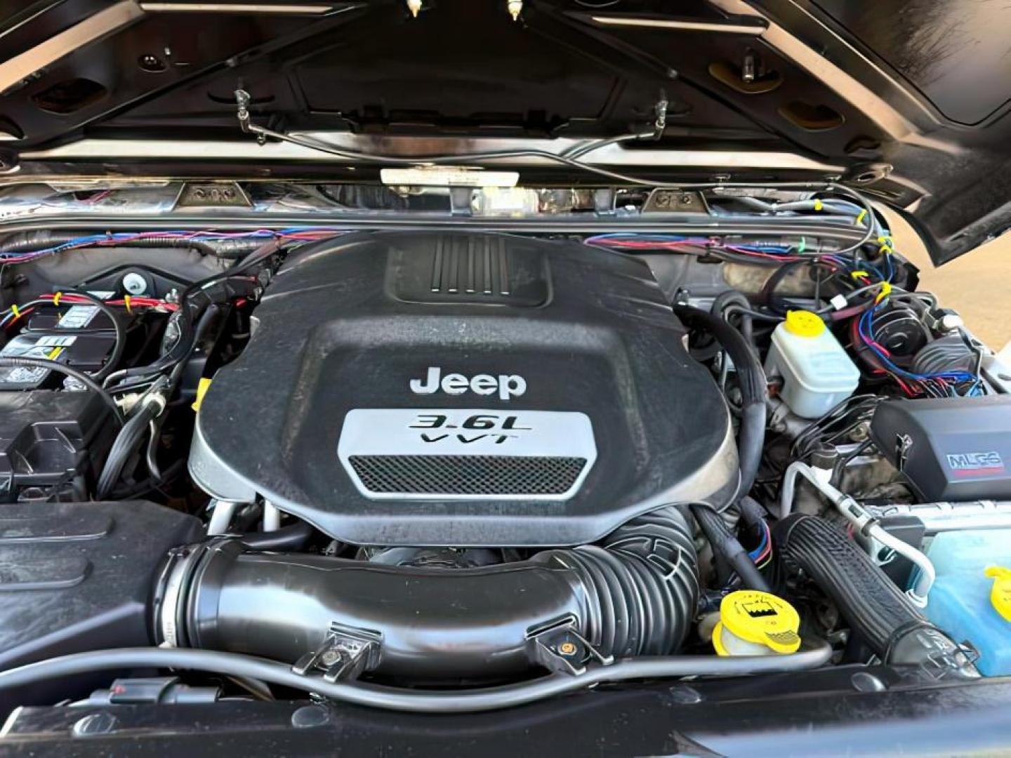 2013 BLACK /CLOTH Jeep Wrangler Unlimited (1C4HJWEG7DL) with an V6 engine, Automatic transmission, located at 1175 N Woodruff Ave, Idaho Falls, ID, 83401, 43.506901, -111.999657 - At Timberline Auto, finding a great deal on your next vehicle is always easy! Our experienced sales staff's goal is to help find you the right vehicle at the right price! Our knowledgeable finance department has options for almost any credit score. We offer extended service contract options to prote - Photo#21