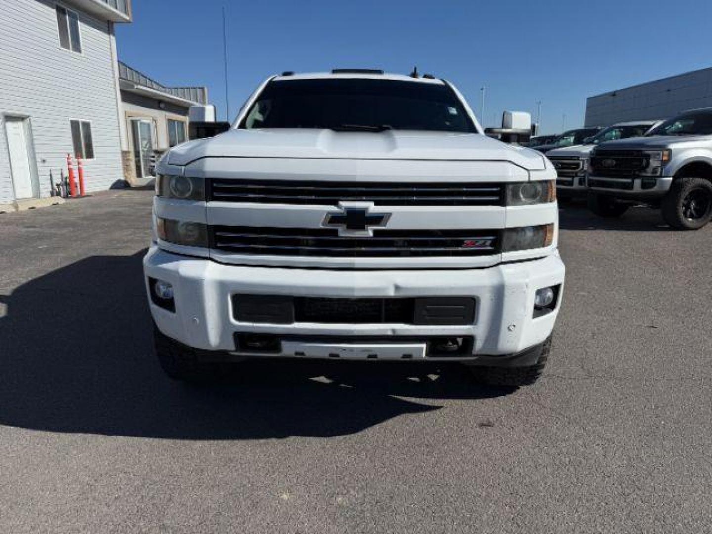 2016 WHITE /LEATHER Chevrolet Silverado 3500HD (1GC4K0C81GF) with an 66 engine, Automatic transmission, located at 1175 N Woodruff Ave, Idaho Falls, ID, 83401, 43.506901, -111.999657 - At Timberline Auto, finding a great deal on your next vehicle is always easy! Our experienced sales staff's goal is to help find you the right vehicle at the right price! Our knowledgeable finance department has options for almost any credit score. We offer extended service contract options to prote - Photo#32