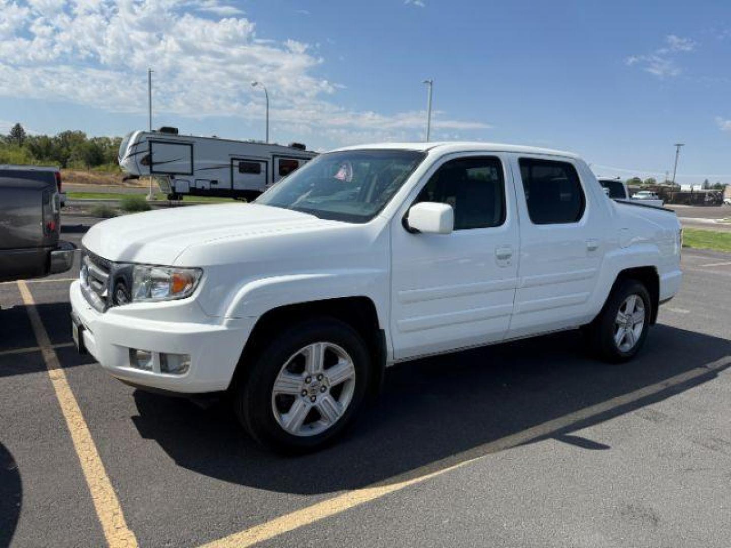 2011 Taffeta White /Black Honda Ridgeline (5FPYK1F5XBB) with an 35L V-6 variable valve control engine, Automatic transmission, located at 1175 N Woodruff Ave, Idaho Falls, ID, 83401, 43.506901, -111.999657 - At Timberline Auto, finding a great deal on your next vehicle is always easy! Our experienced sales staff's goal is to help find you the right vehicle at the right price! Our knowledgeable finance department has options for almost any credit score. We offer extended service contract options to prote - Photo#1