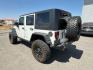 2010 WHITE /Dark Slate Gray/Med Slate Gray Jeep Wrangler Unlimited (1J4BA6H12AL) with an 38L V-6 regular unleaded engine, Automatic transmission, located at 1175 N Woodruff Ave, Idaho Falls, ID, 83401, 43.506901, -111.999657 - At Timberline Auto, finding a great deal on your next vehicle is always easy! Our experienced sales staff's goal is to help find you the right vehicle at the right price! Our knowledgeable finance department has options for almost any credit score. We offer extended service contract options to prote - Photo#3