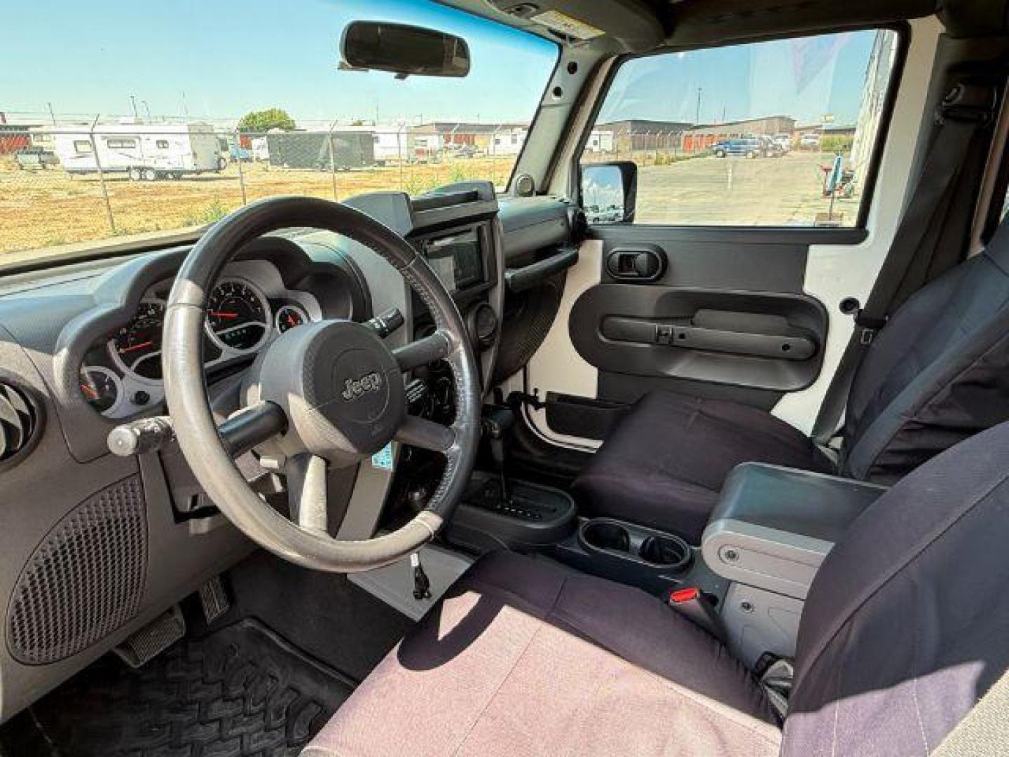 2010 WHITE /Dark Slate Gray/Med Slate Gray Jeep Wrangler Unlimited (1J4BA6H12AL) with an 38L V-6 regular unleaded engine, Automatic transmission, located at 1175 N Woodruff Ave, Idaho Falls, ID, 83401, 43.506901, -111.999657 - At Timberline Auto, finding a great deal on your next vehicle is always easy! Our experienced sales staff's goal is to help find you the right vehicle at the right price! Our knowledgeable finance department has options for almost any credit score. We offer extended service contract options to prote - Photo#13