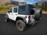 2010 WHITE /Dark Slate Gray/Med Slate Gray Jeep Wrangler Unlimited (1J4BA6H12AL) with an 38L V-6 regular unleaded engine, Automatic transmission, located at 1175 N Woodruff Ave, Idaho Falls, ID, 83401, 43.506901, -111.999657 - At Timberline Auto, finding a great deal on your next vehicle is always easy! Our experienced sales staff's goal is to help find you the right vehicle at the right price! Our knowledgeable finance department has options for almost any credit score. We offer extended service contract options to prote - Photo#2