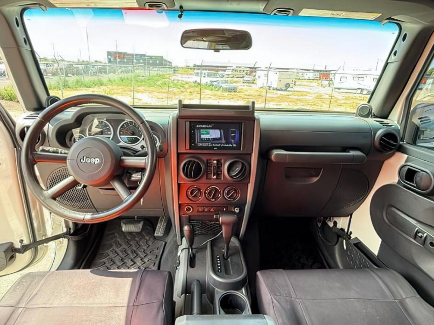 2010 WHITE /Dark Slate Gray/Med Slate Gray Jeep Wrangler Unlimited (1J4BA6H12AL) with an 38L V-6 regular unleaded engine, Automatic transmission, located at 1175 N Woodruff Ave, Idaho Falls, ID, 83401, 43.506901, -111.999657 - At Timberline Auto, finding a great deal on your next vehicle is always easy! Our experienced sales staff's goal is to help find you the right vehicle at the right price! Our knowledgeable finance department has options for almost any credit score. We offer extended service contract options to prote - Photo#16