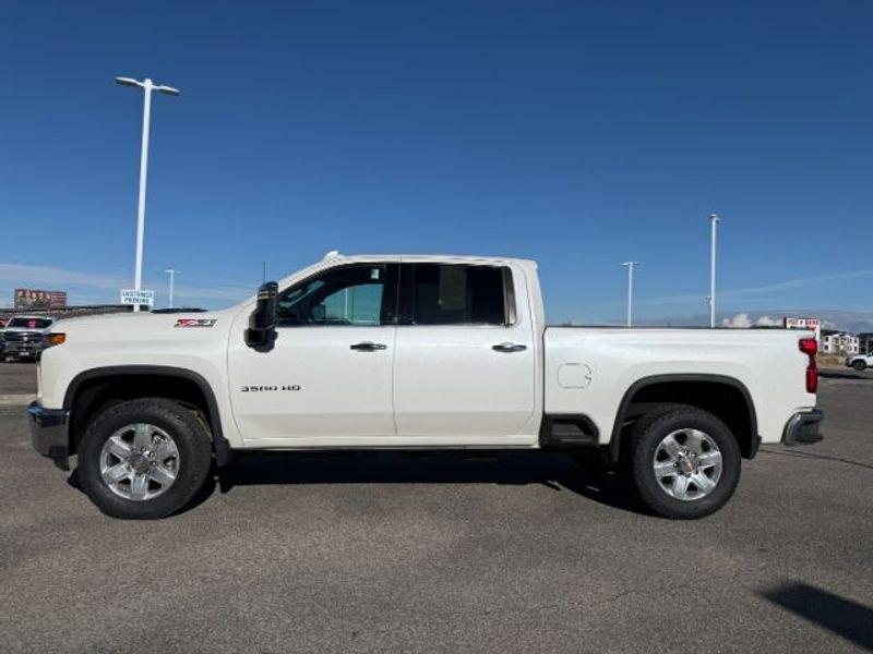 2021 Iridescent Pearl Tricoat /Gideon/Very Dark Atmosphere Chevrolet Silverado LTZ (1GC4YUEY4MF) with an V8, 6.6L engine, 10-speed automatic transmission, located at 1175 N Woodruff Ave, Idaho Falls, ID, 83401, 43.506901, -111.999657 - <b>Vehicle Details</b><br>Discover exceptional capability and premium comfort in this pre-owned 2021 Chevrolet Silverado 3500 LTZ 4WD, now available in Idaho Falls, ID. Powered by a robust V8 6.6L Diesel engine, this heavy-duty pickup is built to handle demanding towing, hauling, and everyday drivin- Photo#1