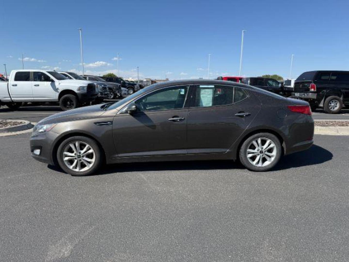 2011 Metal Bronze /Beige KIA Optima (KNAGN4A75B5) with an 24L I-4 gasoline direct injection engine, Automatic transmission, located at 1175 N Woodruff Ave, Idaho Falls, ID, 83401, 43.506901, -111.999657 - At Timberline Auto, finding a great deal on your next vehicle is always easy! Our experienced sales staff's goal is to help find you the right vehicle at the right price! Our knowledgeable finance department has options for almost any credit score. We offer extended service contract options to prote - Photo#1
