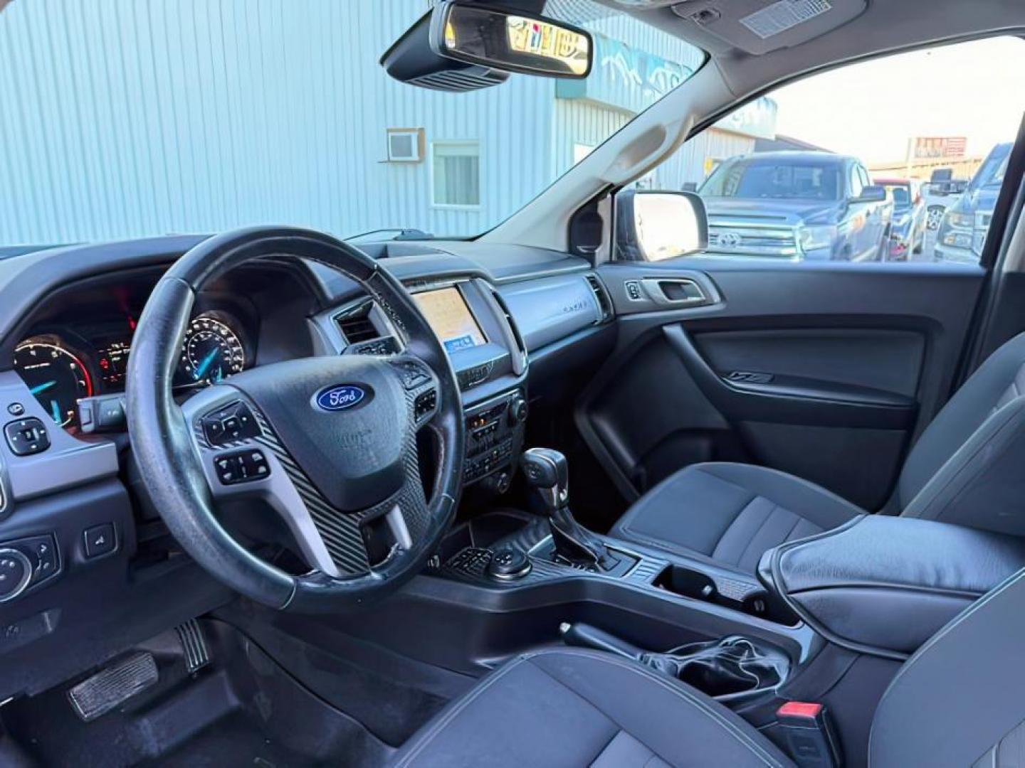 2019 Shadow Black /Ebony Ford Ranger (1FTER4FH8KL) with an EcoBoost 23L I-4 gasoline direct injection engine, Automatic transmission, located at 1175 N Woodruff Ave, Idaho Falls, ID, 83401, 43.506901, -111.999657 - At Timberline Auto, finding a great deal on your next vehicle is always easy! Our experienced sales staff's goal is to help find you the right vehicle at the right price! Our knowledgeable finance department has options for almost any credit score. We offer extended service contract options to prote - Photo#13