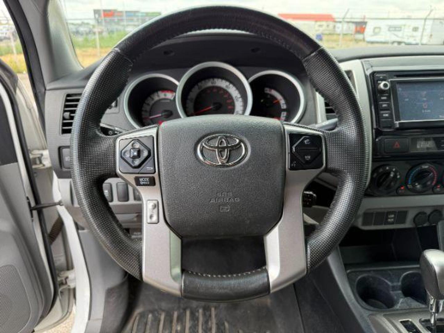 2014 Super White /Graphite Toyota Tacoma (3TMMU4FN9EM) with an 4L V-6 DOHC engine, Automatic transmission, located at 1175 N Woodruff Ave, Idaho Falls, ID, 83401, 43.506901, -111.999657 - Photo#33