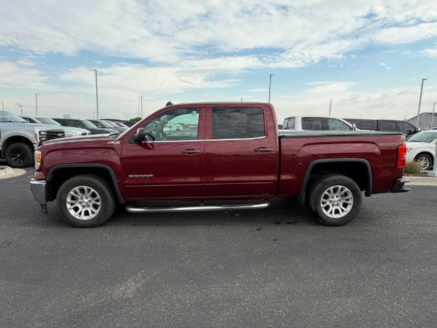 2014 MAROON /Jet Black GMC Sierra 1500 (3GTU2UEC5EG) with an EcoTec3 53L V-8 gasoline direct injection engine, Automatic transmission, located at 1175 N Woodruff Ave, Idaho Falls, ID, 83401, 43.506901, -111.999657 - At Timberline Auto, finding a great deal on your next vehicle is always easy! Our experienced sales staff's goal is to help find you the right vehicle at the right price! Our knowledgeable finance department has options for almost any credit score. We offer extended service contract options to prote - Photo#1