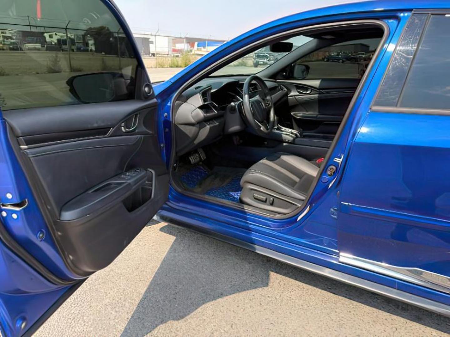 2020 BLUE /SPORT Honda Civic Hatchback (SHHFK7H90LU) with an 15 I4 TURBO engine, Automatic transmission, located at 1175 N Woodruff Ave, Idaho Falls, ID, 83401, 43.506901, -111.999657 - At Timberline Auto, finding a great deal on your next vehicle is always easy! Our experienced sales staff's goal is to help find you the right vehicle at the right price! Our knowledgeable finance department has options for almost any credit score. We offer extended service contract options to prote - Photo#11