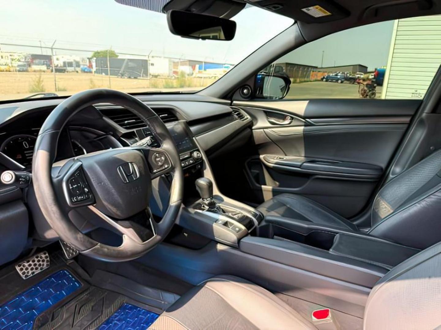 2020 BLUE /SPORT Honda Civic Hatchback (SHHFK7H90LU) with an 15 I4 TURBO engine, Automatic transmission, located at 1175 N Woodruff Ave, Idaho Falls, ID, 83401, 43.506901, -111.999657 - At Timberline Auto, finding a great deal on your next vehicle is always easy! Our experienced sales staff's goal is to help find you the right vehicle at the right price! Our knowledgeable finance department has options for almost any credit score. We offer extended service contract options to prote - Photo#13