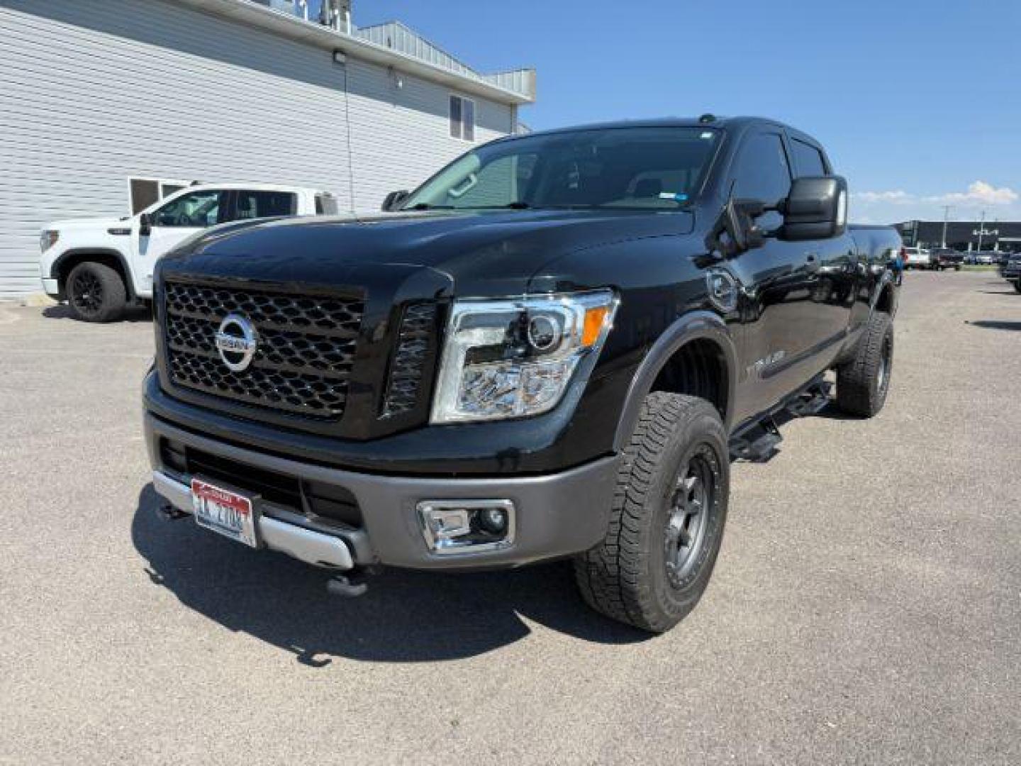 2017 BLACK /Black Nissan TITAN XD (1N6BA1F42HN) with an 5L V-8 diesel direct injection engine, Automatic transmission, located at 1175 N Woodruff Ave, Idaho Falls, ID, 83401, 43.506901, -111.999657 - At Timberline Auto, finding a great deal on your next vehicle is always easy! Our experienced sales staff's goal is to help find you the right vehicle at the right price! Our knowledgeable finance department has options for almost any credit score. We offer extended service contract options to prote - Photo#22