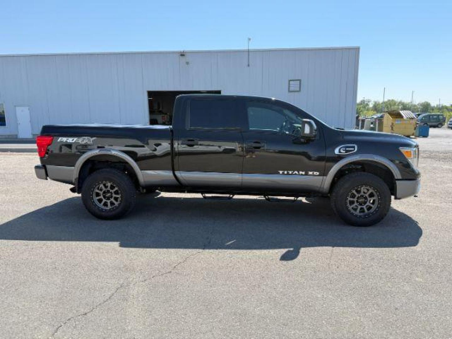 2017 BLACK /Black Nissan TITAN XD (1N6BA1F42HN) with an 5L V-8 diesel direct injection engine, Automatic transmission, located at 1175 N Woodruff Ave, Idaho Falls, ID, 83401, 43.506901, -111.999657 - At Timberline Auto, finding a great deal on your next vehicle is always easy! Our experienced sales staff's goal is to help find you the right vehicle at the right price! Our knowledgeable finance department has options for almost any credit score. We offer extended service contract options to prote - Photo#27