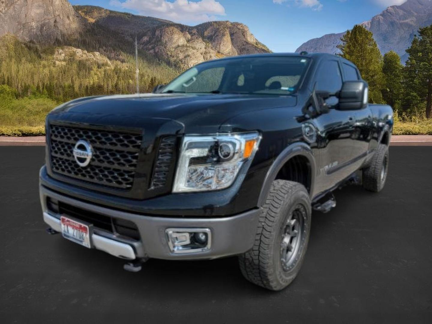 2017 BLACK /Black Nissan TITAN XD (1N6BA1F42HN) with an 5L V-8 diesel direct injection engine, Automatic transmission, located at 1175 N Woodruff Ave, Idaho Falls, ID, 83401, 43.506901, -111.999657 - At Timberline Auto, finding a great deal on your next vehicle is always easy! Our experienced sales staff's goal is to help find you the right vehicle at the right price! Our knowledgeable finance department has options for almost any credit score. We offer extended service contract options to prote - Photo#0