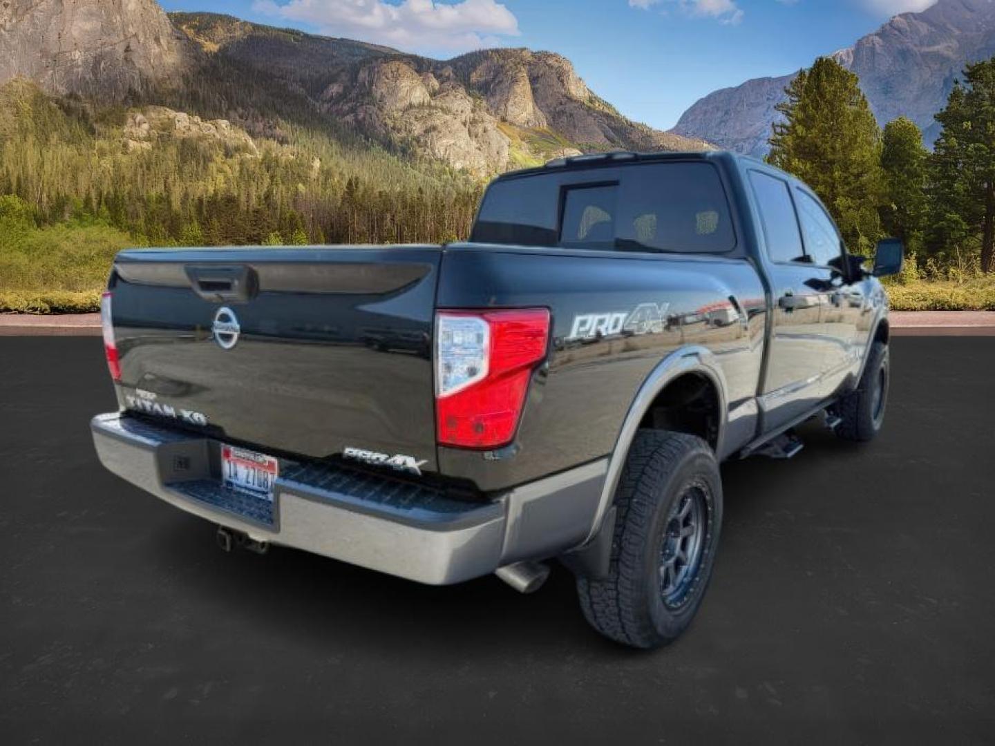 2017 BLACK /Black Nissan TITAN XD (1N6BA1F42HN) with an 5L V-8 diesel direct injection engine, Automatic transmission, located at 1175 N Woodruff Ave, Idaho Falls, ID, 83401, 43.506901, -111.999657 - At Timberline Auto, finding a great deal on your next vehicle is always easy! Our experienced sales staff's goal is to help find you the right vehicle at the right price! Our knowledgeable finance department has options for almost any credit score. We offer extended service contract options to prote - Photo#4