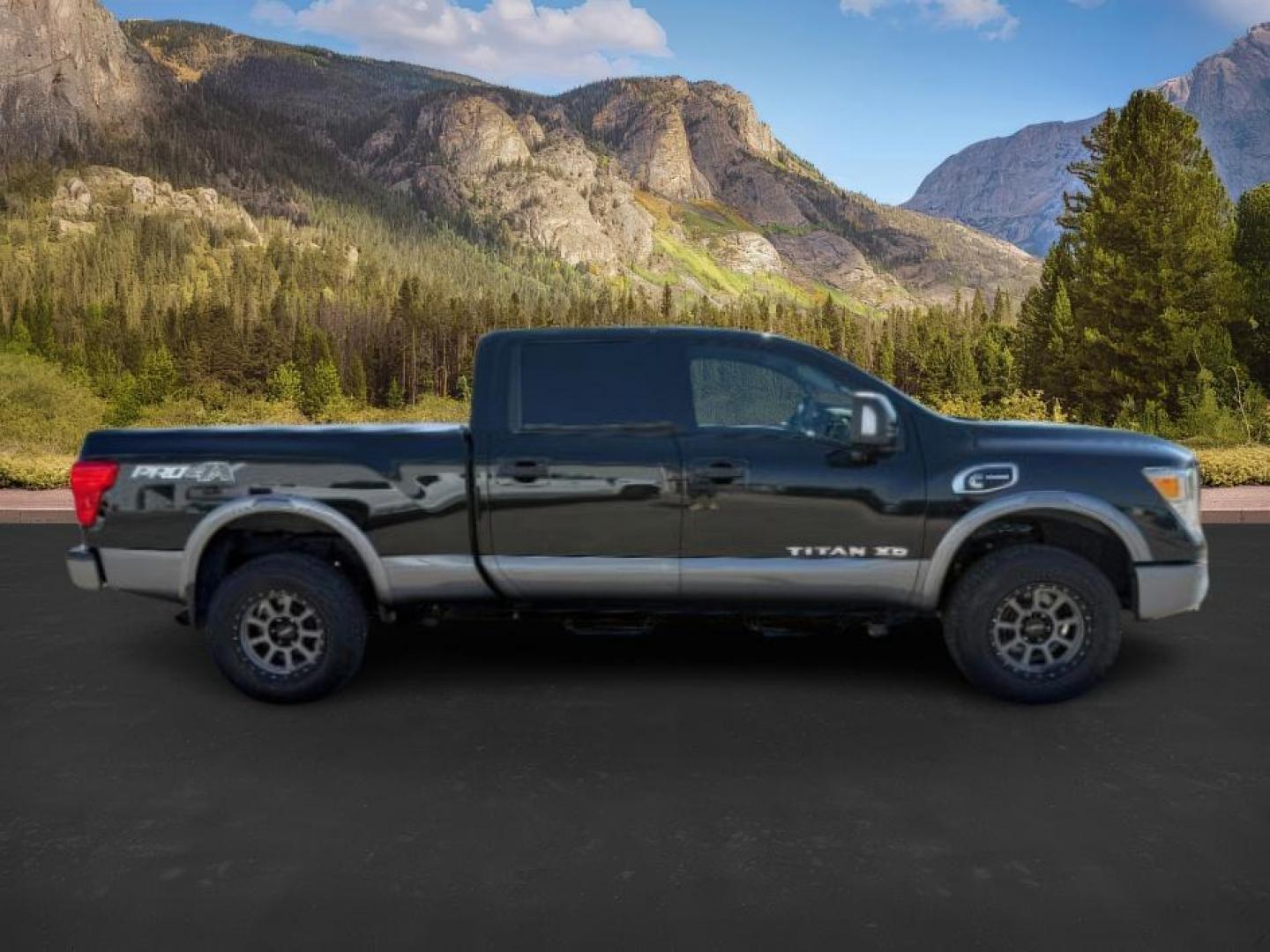 2017 BLACK /Black Nissan TITAN XD (1N6BA1F42HN) with an 5L V-8 diesel direct injection engine, Automatic transmission, located at 1175 N Woodruff Ave, Idaho Falls, ID, 83401, 43.506901, -111.999657 - At Timberline Auto, finding a great deal on your next vehicle is always easy! Our experienced sales staff's goal is to help find you the right vehicle at the right price! Our knowledgeable finance department has options for almost any credit score. We offer extended service contract options to prote - Photo#5