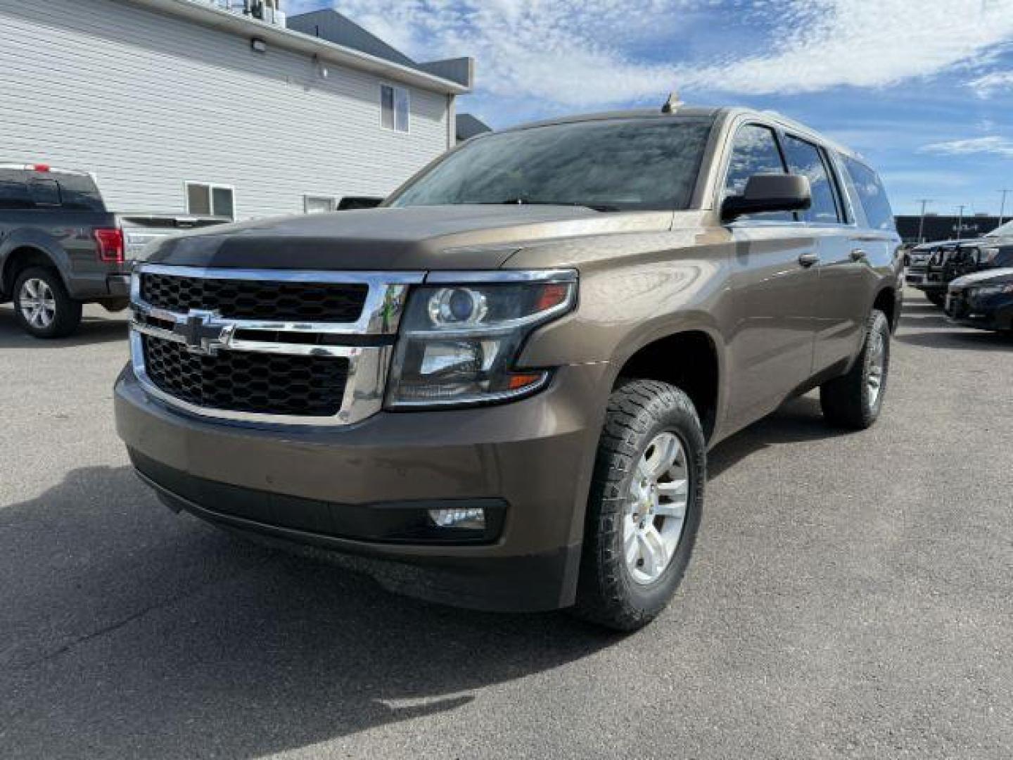 2015 BROWN /Cocoa/Dune Chevrolet Suburban 1500 (1GNSKJKC6FR) with an EcoTec3 53L V-8 gasoline direct injection engine, Automatic transmission, located at 1175 N Woodruff Ave, Idaho Falls, ID, 83401, 43.506901, -111.999657 - At Timberline Auto, finding a great deal on your next vehicle is always easy! Our experienced sales staff's goal is to help find you the right vehicle at the right price! Our knowledgeable finance department has options for almost any credit score. We offer extended service contract options to prote - Photo#0