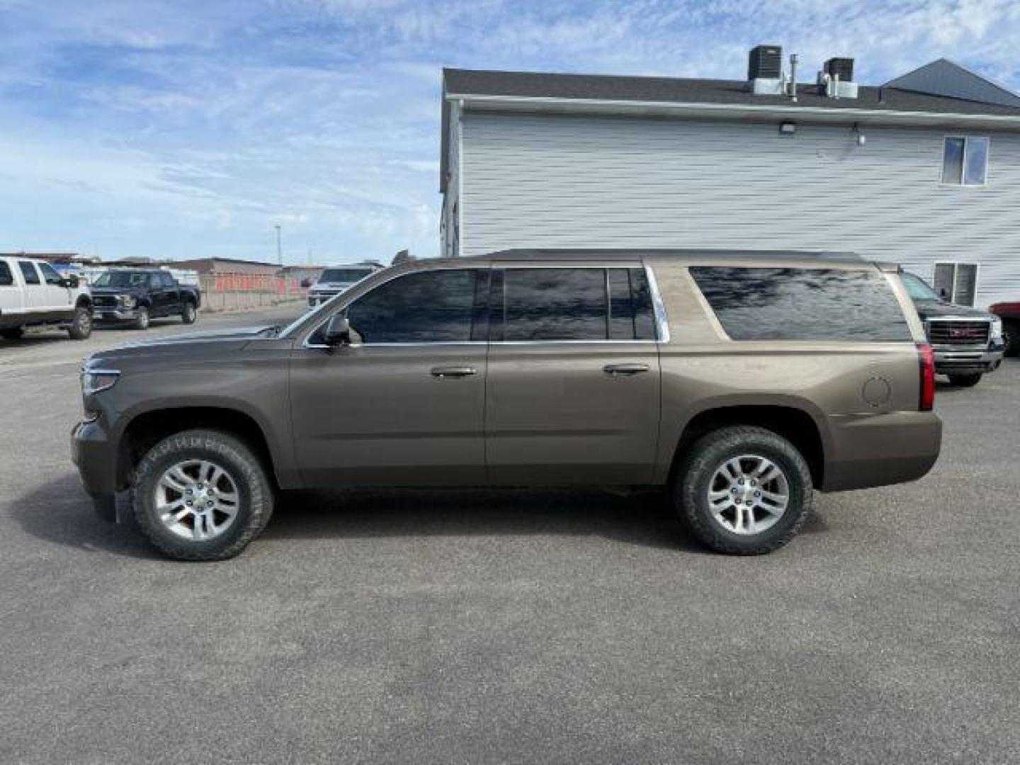 2015 BROWN /Cocoa/Dune Chevrolet Suburban 1500 (1GNSKJKC6FR) with an EcoTec3 53L V-8 gasoline direct injection engine, Automatic transmission, located at 1175 N Woodruff Ave, Idaho Falls, ID, 83401, 43.506901, -111.999657 - At Timberline Auto, finding a great deal on your next vehicle is always easy! Our experienced sales staff's goal is to help find you the right vehicle at the right price! Our knowledgeable finance department has options for almost any credit score. We offer extended service contract options to prote - Photo#1