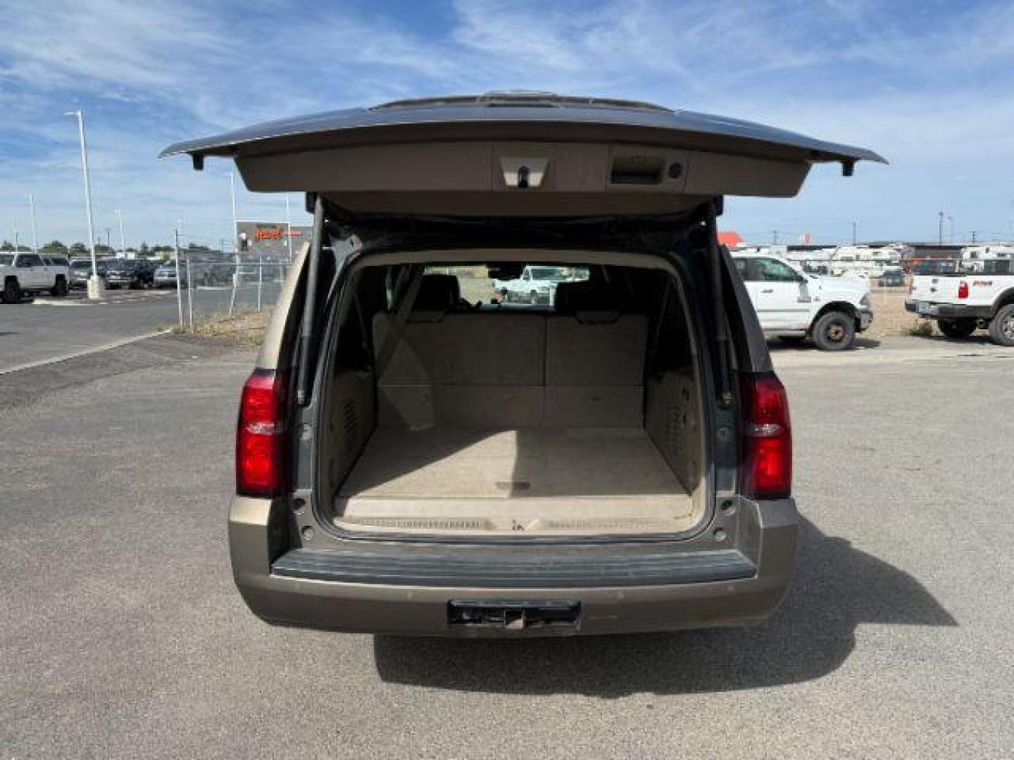 2015 BROWN /Cocoa/Dune Chevrolet Suburban 1500 (1GNSKJKC6FR) with an EcoTec3 53L V-8 gasoline direct injection engine, Automatic transmission, located at 1175 N Woodruff Ave, Idaho Falls, ID, 83401, 43.506901, -111.999657 - At Timberline Auto, finding a great deal on your next vehicle is always easy! Our experienced sales staff's goal is to help find you the right vehicle at the right price! Our knowledgeable finance department has options for almost any credit score. We offer extended service contract options to prote - Photo#4