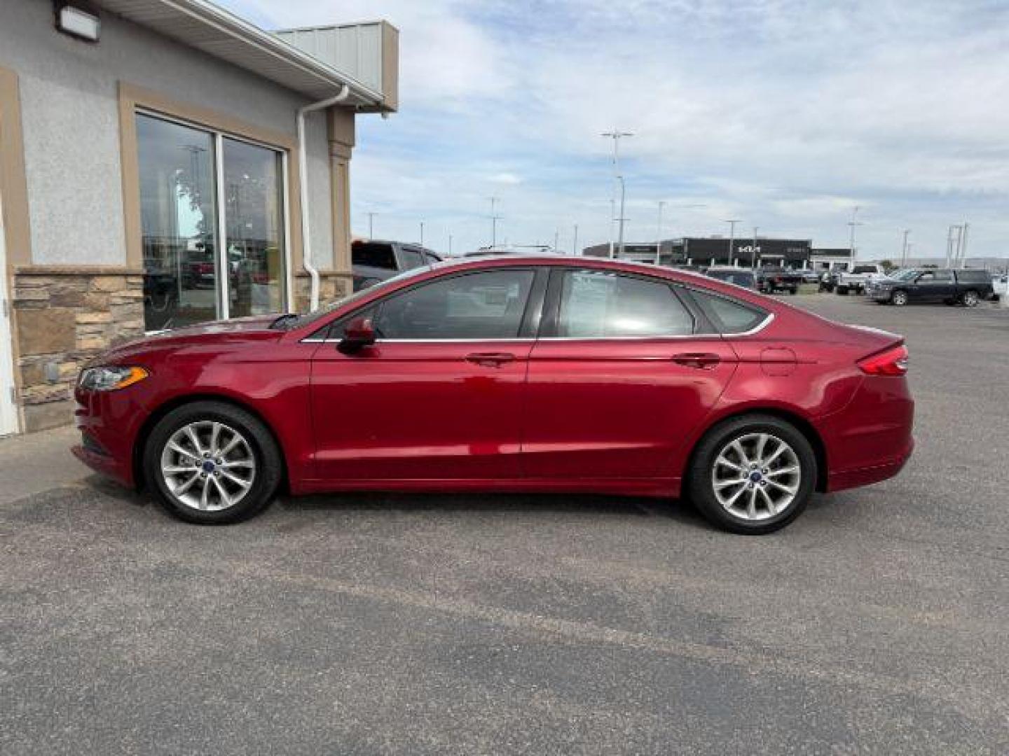 2017 Ruby Red Metallic Tinted Clearcoat /Ebony Ford Fusion (3FA6P0HD7HR) with an EcoBoost 15L I-4 gasoline direct injection engine, Automatic transmission, located at 1175 N Woodruff Ave, Idaho Falls, ID, 83401, 43.506901, -111.999657 - At Timberline Auto, finding a great deal on your next vehicle is always easy! Our experienced sales staff's goal is to help find you the right vehicle at the right price! Our knowledgeable finance department has options for almost any credit score. We offer extended service contract options to prote - Photo#0