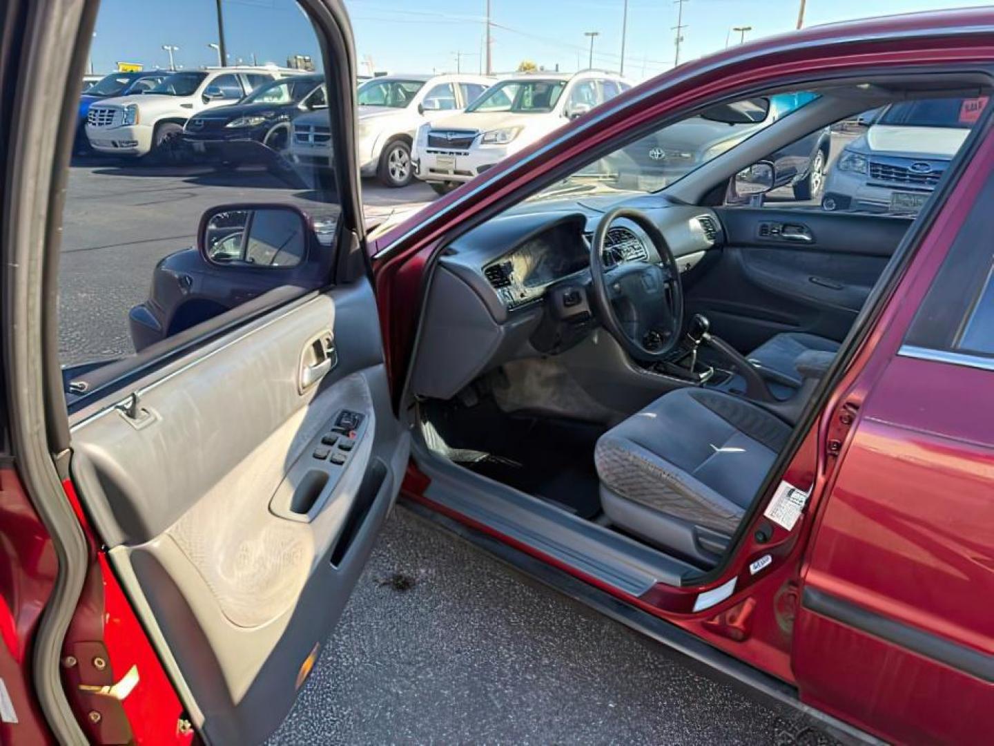 1997 MAROON /Gray Honda Accord (1HGCD5531VA) with an 22L I-4 regular unleaded engine, Manual transmission, located at 1175 N Woodruff Ave, Idaho Falls, ID, 83401, 43.506901, -111.999657 - At Timberline Auto, finding a great deal on your next vehicle is always easy! Our experienced sales staff's goal is to help find you the right vehicle at the right price! Our knowledgeable finance department has options for almost any credit score. We offer extended service contract options to prote - Photo#9