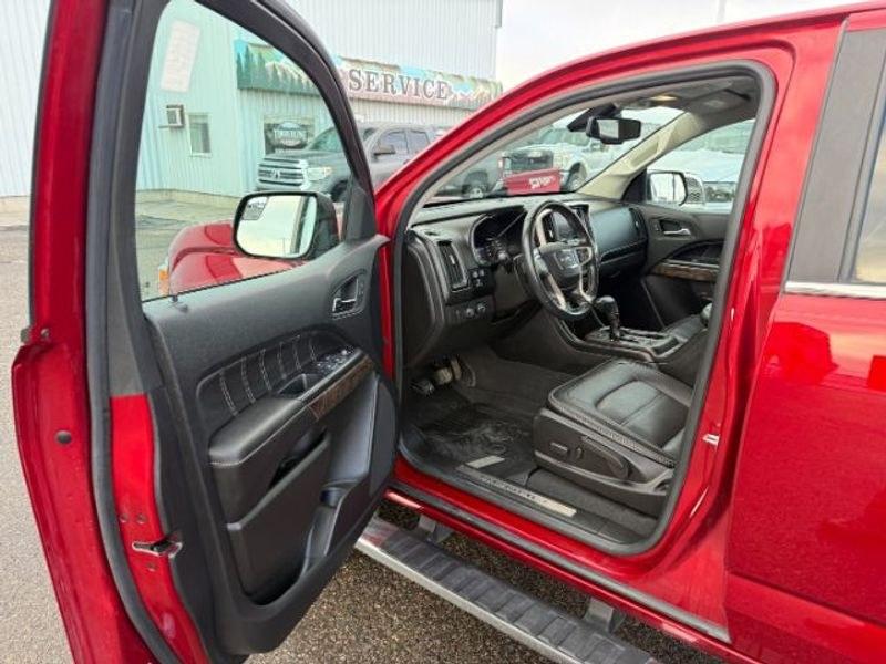 2021 Cayenne Red Tintcoat /Jet Black GMC Canyon 4WD Denali (1GTG6EEN5M1) with an V6, 3.6L engine, 8-speed automatic transmission, located at 1175 N Woodruff Ave, Idaho Falls, ID, 83401, 43.506901, -111.999657 - <b>Vehicle Details</b><br>Elevate every drive with this 2021 GMC Canyon Denali 4WD, now available in Idaho Falls, ID. This premium midsize truck brings bold style, refined comfort, and serious capability together in one impressive package. Powered by a V6, 3.6L gasoline engine, it delivers confident- Photo#10
