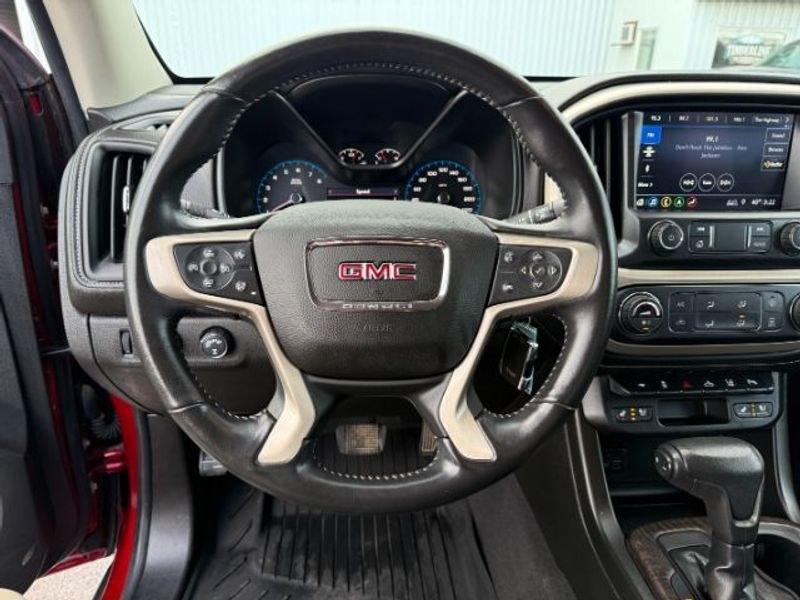 2021 Cayenne Red Tintcoat /Jet Black GMC Canyon 4WD Denali (1GTG6EEN5M1) with an V6, 3.6L engine, 8-speed automatic transmission, located at 1175 N Woodruff Ave, Idaho Falls, ID, 83401, 43.506901, -111.999657 - <b>Vehicle Details</b><br>Elevate every drive with this 2021 GMC Canyon Denali 4WD, now available in Idaho Falls, ID. This premium midsize truck brings bold style, refined comfort, and serious capability together in one impressive package. Powered by a V6, 3.6L gasoline engine, it delivers confident- Photo#13