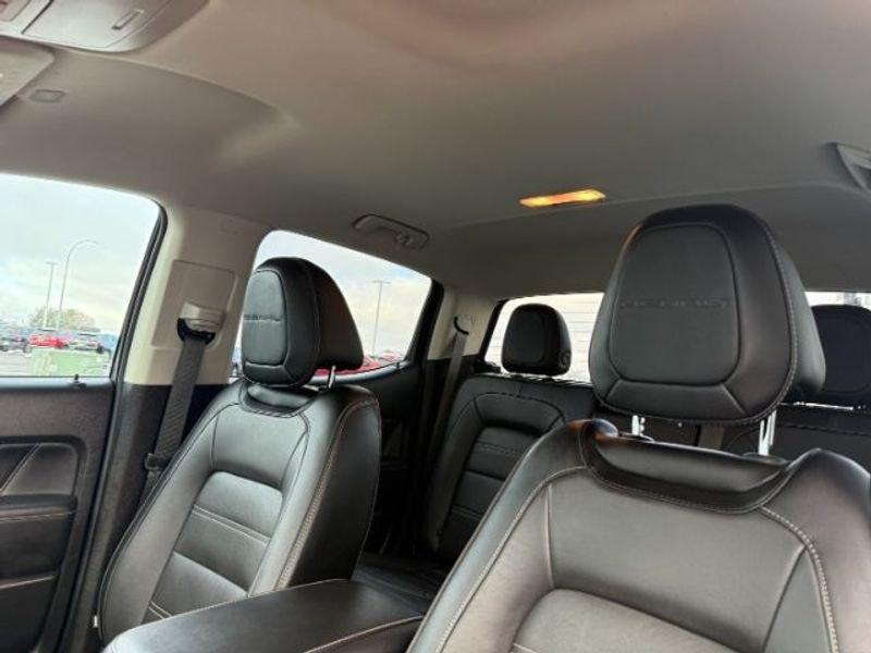 2021 Cayenne Red Tintcoat /Jet Black GMC Canyon 4WD Denali (1GTG6EEN5M1) with an V6, 3.6L engine, 8-speed automatic transmission, located at 1175 N Woodruff Ave, Idaho Falls, ID, 83401, 43.506901, -111.999657 - <b>Vehicle Details</b><br>Elevate every drive with this 2021 GMC Canyon Denali 4WD, now available in Idaho Falls, ID. This premium midsize truck brings bold style, refined comfort, and serious capability together in one impressive package. Powered by a V6, 3.6L gasoline engine, it delivers confident- Photo#18