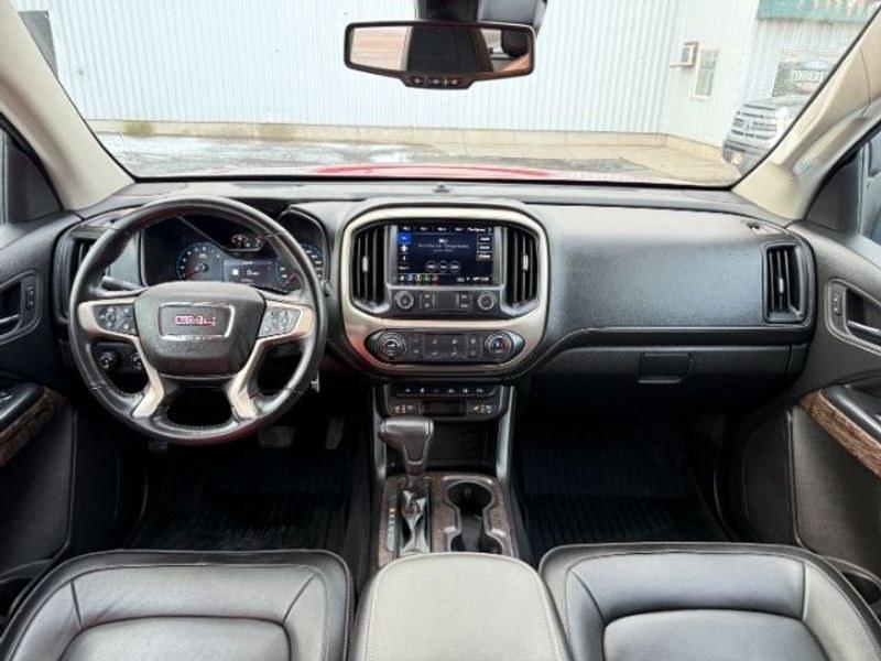 2021 Cayenne Red Tintcoat /Jet Black GMC Canyon 4WD Denali (1GTG6EEN5M1) with an V6, 3.6L engine, 8-speed automatic transmission, located at 1175 N Woodruff Ave, Idaho Falls, ID, 83401, 43.506901, -111.999657 - <b>Vehicle Details</b><br>Elevate every drive with this 2021 GMC Canyon Denali 4WD, now available in Idaho Falls, ID. This premium midsize truck brings bold style, refined comfort, and serious capability together in one impressive package. Powered by a V6, 3.6L gasoline engine, it delivers confident- Photo#20