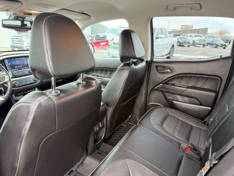 2021 Cayenne Red Tintcoat /Jet Black GMC Canyon 4WD Denali (1GTG6EEN5M1) with an V6, 3.6L engine, 8-speed automatic transmission, located at 1175 N Woodruff Ave, Idaho Falls, ID, 83401, 43.506901, -111.999657 - <b>Vehicle Details</b><br>Elevate every drive with this 2021 GMC Canyon Denali 4WD, now available in Idaho Falls, ID. This premium midsize truck brings bold style, refined comfort, and serious capability together in one impressive package. Powered by a V6, 3.6L gasoline engine, it delivers confident- Photo#22