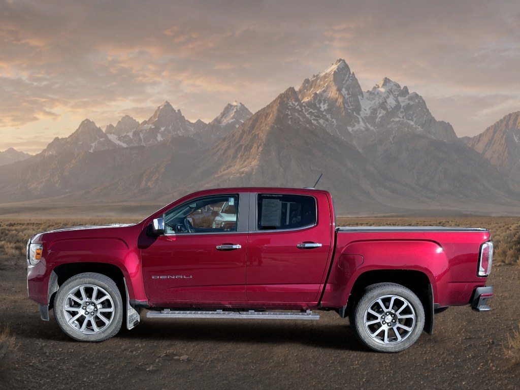2021 Cayenne Red Tintcoat /Jet Black GMC Canyon 4WD Denali (1GTG6EEN5M1) with an V6, 3.6L engine, 8-speed automatic transmission, located at 1175 N Woodruff Ave, Idaho Falls, ID, 83401, 43.506901, -111.999657 - <b>Vehicle Details</b><br>Elevate every drive with this 2021 GMC Canyon Denali 4WD, now available in Idaho Falls, ID. This premium midsize truck brings bold style, refined comfort, and serious capability together in one impressive package. Powered by a V6, 3.6L gasoline engine, it delivers confident- Photo#1