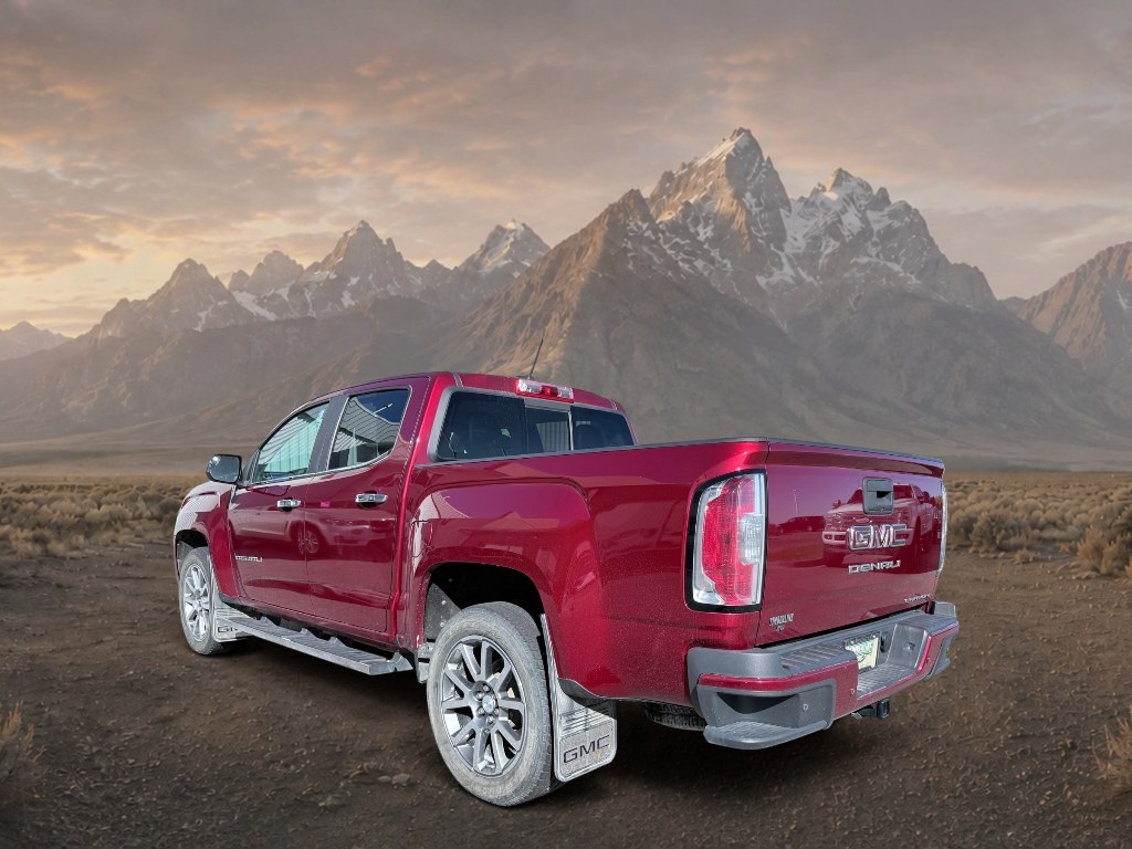2021 Cayenne Red Tintcoat /Jet Black GMC Canyon 4WD Denali (1GTG6EEN5M1) with an V6, 3.6L engine, 8-speed automatic transmission, located at 1175 N Woodruff Ave, Idaho Falls, ID, 83401, 43.506901, -111.999657 - <b>Vehicle Details</b><br>Elevate every drive with this 2021 GMC Canyon Denali 4WD, now available in Idaho Falls, ID. This premium midsize truck brings bold style, refined comfort, and serious capability together in one impressive package. Powered by a V6, 3.6L gasoline engine, it delivers confident- Photo#2
