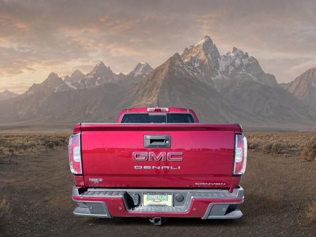2021 Cayenne Red Tintcoat /Jet Black GMC Canyon 4WD Denali (1GTG6EEN5M1) with an V6, 3.6L engine, 8-speed automatic transmission, located at 1175 N Woodruff Ave, Idaho Falls, ID, 83401, 43.506901, -111.999657 - <b>Vehicle Details</b><br>Elevate every drive with this 2021 GMC Canyon Denali 4WD, now available in Idaho Falls, ID. This premium midsize truck brings bold style, refined comfort, and serious capability together in one impressive package. Powered by a V6, 3.6L gasoline engine, it delivers confident- Photo#3
