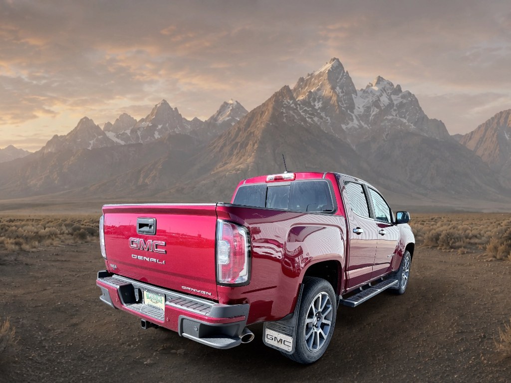 2021 Cayenne Red Tintcoat /Jet Black GMC Canyon 4WD Denali (1GTG6EEN5M1) with an V6, 3.6L engine, 8-speed automatic transmission, located at 1175 N Woodruff Ave, Idaho Falls, ID, 83401, 43.506901, -111.999657 - <b>Vehicle Details</b><br>Elevate every drive with this 2021 GMC Canyon Denali 4WD, now available in Idaho Falls, ID. This premium midsize truck brings bold style, refined comfort, and serious capability together in one impressive package. Powered by a V6, 3.6L gasoline engine, it delivers confident- Photo#4