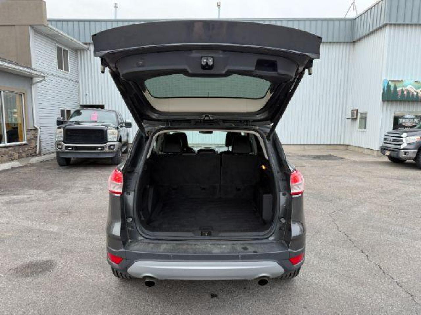 2015 GRAY /Charcoal Black Ford Escape (1FMCU9G91FU) with an EcoBoost 2L I-4 gasoline direct injection engine, Automatic transmission, located at 1175 N Woodruff Ave, Idaho Falls, ID, 83401, 43.506901, -111.999657 - At Timberline Auto, finding a great deal on your next vehicle is always easy! Our experienced sales staff's goal is to help find you the right vehicle at the right price! Our knowledgeable finance department has options for almost any credit score. We offer extended service contract options to prote - Photo#30