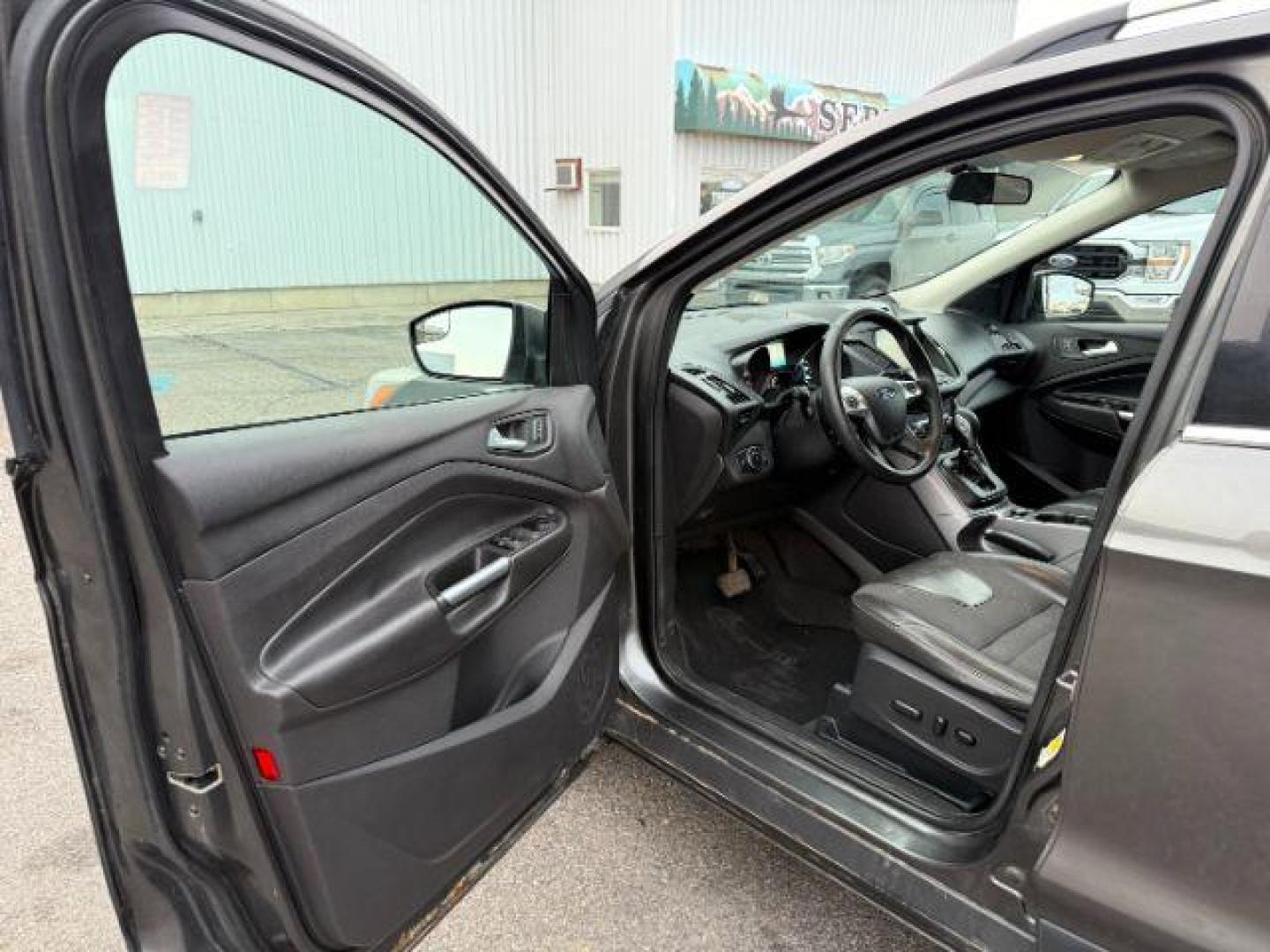 2015 GRAY /Charcoal Black Ford Escape (1FMCU9G91FU) with an EcoBoost 2L I-4 gasoline direct injection engine, Automatic transmission, located at 1175 N Woodruff Ave, Idaho Falls, ID, 83401, 43.506901, -111.999657 - At Timberline Auto, finding a great deal on your next vehicle is always easy! Our experienced sales staff's goal is to help find you the right vehicle at the right price! Our knowledgeable finance department has options for almost any credit score. We offer extended service contract options to prote - Photo#38