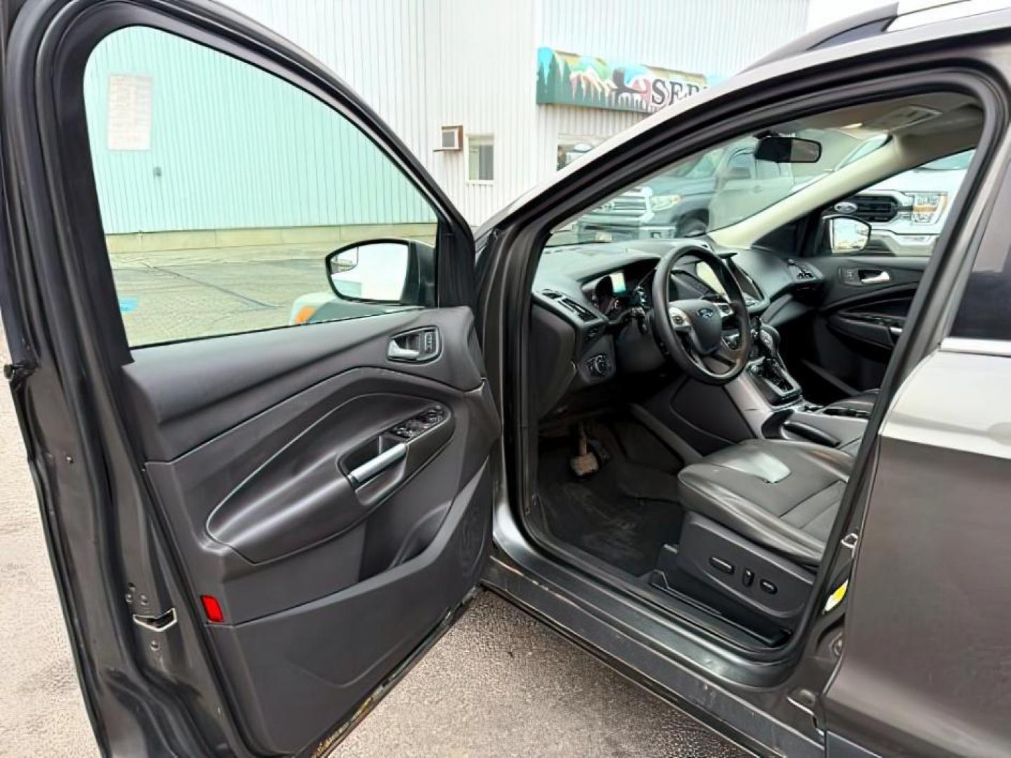 2015 GRAY /Charcoal Black Ford Escape (1FMCU9G91FU) with an EcoBoost 2L I-4 gasoline direct injection engine, Automatic transmission, located at 1175 N Woodruff Ave, Idaho Falls, ID, 83401, 43.506901, -111.999657 - At Timberline Auto, finding a great deal on your next vehicle is always easy! Our experienced sales staff's goal is to help find you the right vehicle at the right price! Our knowledgeable finance department has options for almost any credit score. We offer extended service contract options to prote - Photo#13