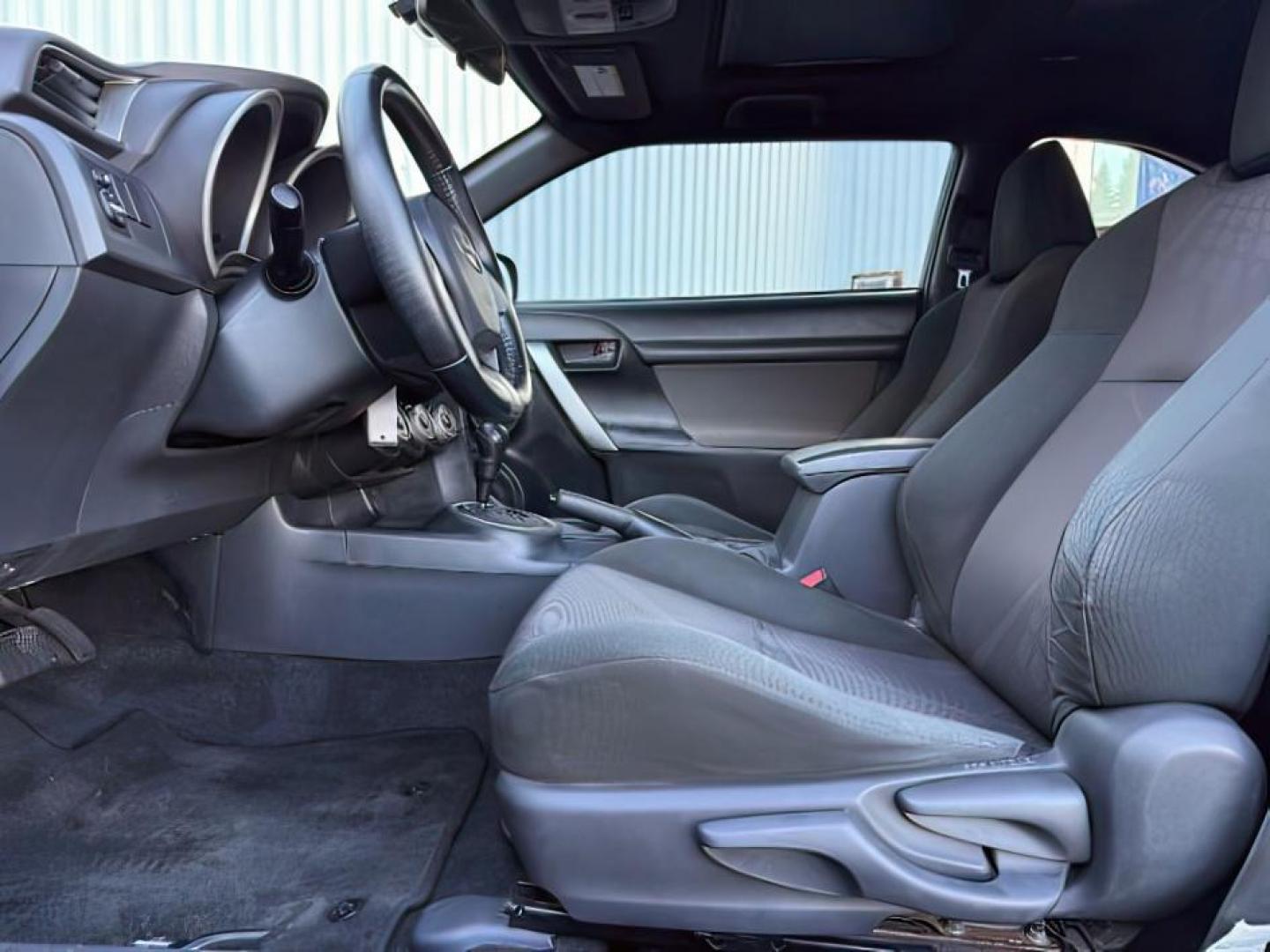 2012 Magnetic Gray Metallic /Dark Charcoal Scion tC (JTKJF5C78C3) with an 25L I-4 DOHC engine, Automatic transmission, located at 1175 N Woodruff Ave, Idaho Falls, ID, 83401, 43.506901, -111.999657 - At Timberline Auto, finding a great deal on your next vehicle is always easy! Our experienced sales staff's goal is to help find you the right vehicle at the right price! Our knowledgeable finance department has options for almost any credit score. We offer extended service contract options to prote - Photo#10