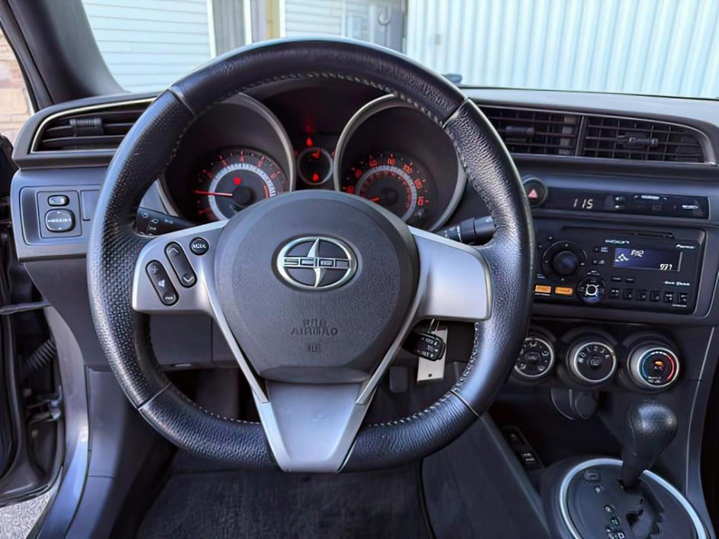 2012 Magnetic Gray Metallic /Dark Charcoal Scion tC (JTKJF5C78C3) with an 25L I-4 DOHC engine, Automatic transmission, located at 1175 N Woodruff Ave, Idaho Falls, ID, 83401, 43.506901, -111.999657 - At Timberline Auto, finding a great deal on your next vehicle is always easy! Our experienced sales staff's goal is to help find you the right vehicle at the right price! Our knowledgeable finance department has options for almost any credit score. We offer extended service contract options to prote - Photo#11