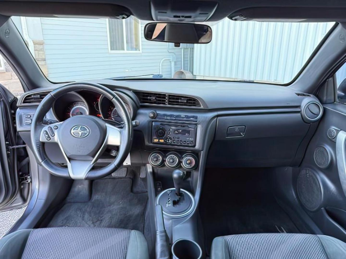 2012 Magnetic Gray Metallic /Dark Charcoal Scion tC (JTKJF5C78C3) with an 25L I-4 DOHC engine, Automatic transmission, located at 1175 N Woodruff Ave, Idaho Falls, ID, 83401, 43.506901, -111.999657 - At Timberline Auto, finding a great deal on your next vehicle is always easy! Our experienced sales staff's goal is to help find you the right vehicle at the right price! Our knowledgeable finance department has options for almost any credit score. We offer extended service contract options to prote - Photo#16