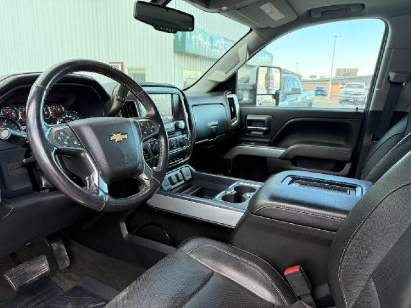 2016 Silver Ice Metallic /Jet Black Chevrolet Silverado 2500HD (1GC1KWE8XGF) with an 66L V8 16V OHV TURBO DIESEL engine, Automatic transmission, located at 1175 N Woodruff Ave, Idaho Falls, ID, 83401, 43.506901, -111.999657 - At Timberline Auto, finding a great deal on your next vehicle is always easy! Our experienced sales staff's goal is to help find you the right vehicle at the right price! Our knowledgeable finance department has options for almost any credit score. We offer extended service contract options to prote - Photo#40