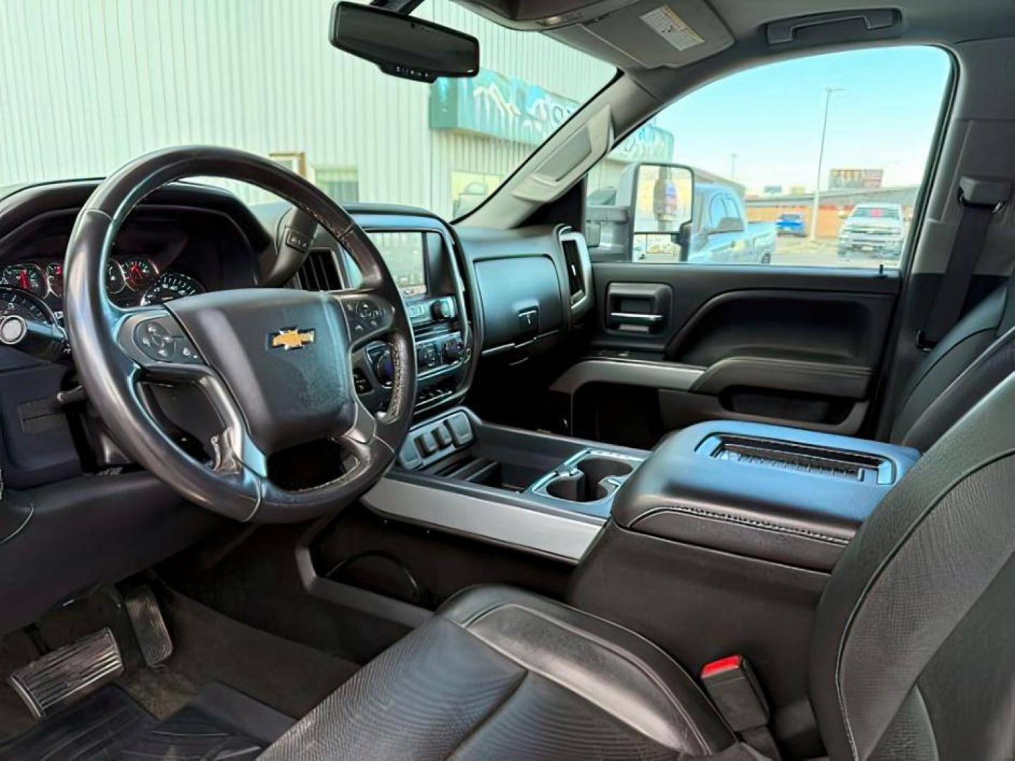 2016 Silver Ice Metallic /Jet Black Chevrolet Silverado 2500HD (1GC1KWE8XGF) with an 66L V8 16V OHV TURBO DIESEL engine, Automatic transmission, located at 1175 N Woodruff Ave, Idaho Falls, ID, 83401, 43.506901, -111.999657 - At Timberline Auto, finding a great deal on your next vehicle is always easy! Our experienced sales staff's goal is to help find you the right vehicle at the right price! Our knowledgeable finance department has options for almost any credit score. We offer extended service contract options to prote - Photo#14