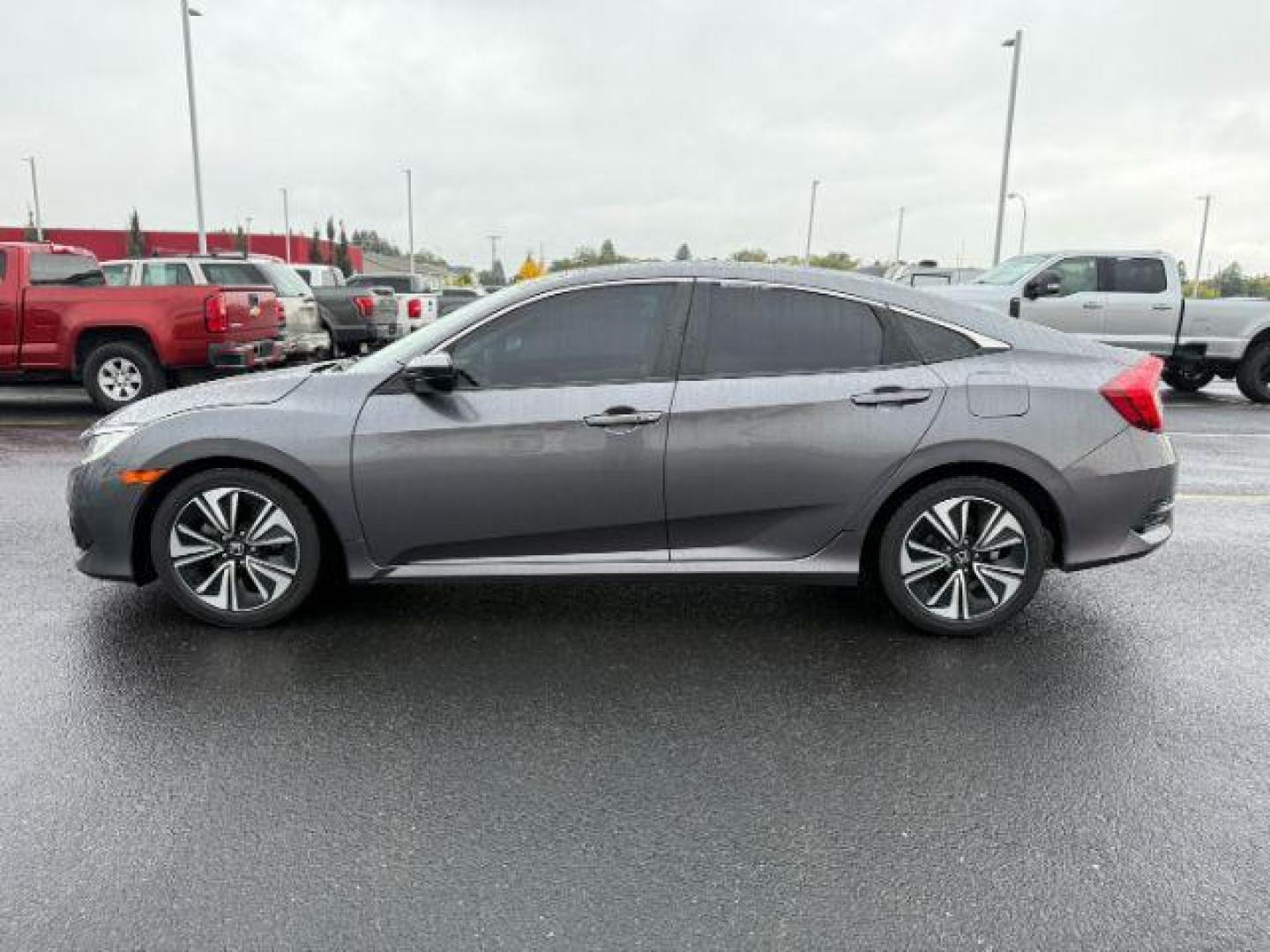 2017 gray /Black Honda Civic (19XFC1F35HE) with an 15L I-4 gasoline direct injection engine, Automatic transmission, located at 1175 N Woodruff Ave, Idaho Falls, ID, 83401, 43.506901, -111.999657 - At Timberline Auto, finding a great deal on your next vehicle is always easy! Our experienced sales staff's goal is to help find you the right vehicle at the right price! Our knowledgeable finance department has options for almost any credit score. We offer extended service contract options to prote - Photo#1