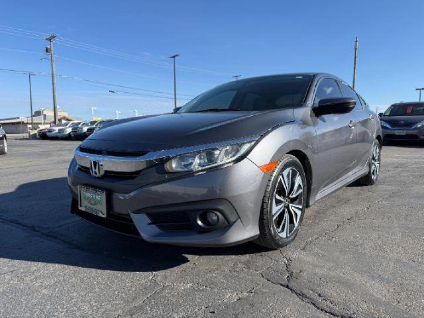 2017 GRAY /Black Honda Civic (19XFC1F35HE) with an 15L I-4 gasoline direct injection engine, Automatic transmission, located at 1175 N Woodruff Ave, Idaho Falls, ID, 83401, 43.506901, -111.999657 - At Timberline Auto, finding a great deal on your next vehicle is always easy! Our experienced sales staff's goal is to help find you the right vehicle at the right price! Our knowledgeable finance department has options for almost any credit score. We offer extended service contract options to prote - Photo#21